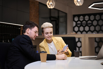 Woman showing her start-up ideas to partner