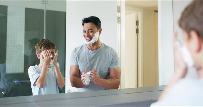 Teaching shave, happy and a father and child in the bathroom bonding and learning together. Help, smile and a dad with a boy kid shaving with cream and talking in the mirror reflection in the morning