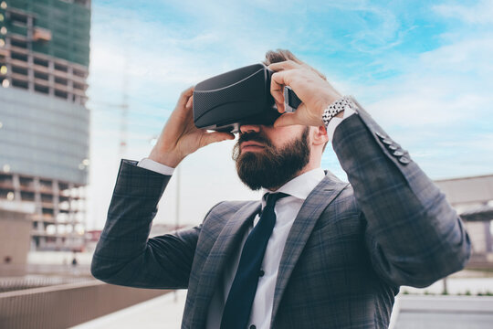 Elegant executive professional businessman bearded using 3D viewer