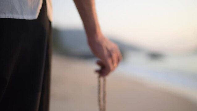 meditation on the beads closeup, walk along the seashore