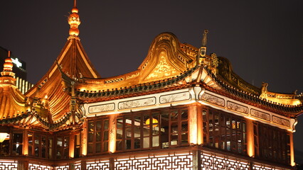 The old buildings night view with the lights on located in Shanghai of the city in China