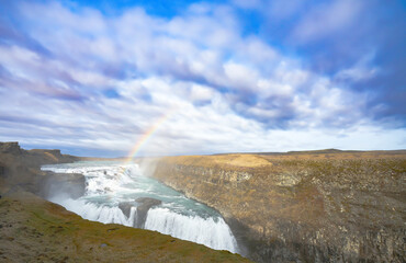 waterfall Gull-Foss(Golden falls) Iceland. beautiful rainbow above Gull Foss waterfall.