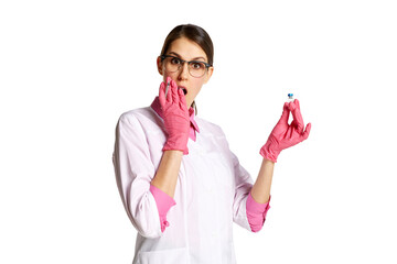 Yougn woman, nurse, doctor in lab coat and stethoscope, holding syringe with meds isolated over white background. Concept of medicine, occupational, healthcare, profession, treatment