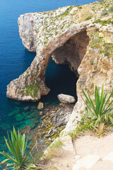 View of a natural cliff arch, the Blue Grotto on Malta island
