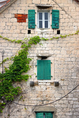 Picturesque windows on traditional old Mediterranean house in Split, Croatia.
