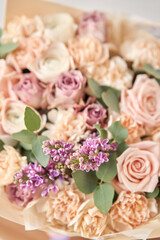 Obraz na płótnie Canvas Beautiful bouquet of flowers on table. Floral shop concept . Beautiful fresh cut bouquet. Flowers delivery