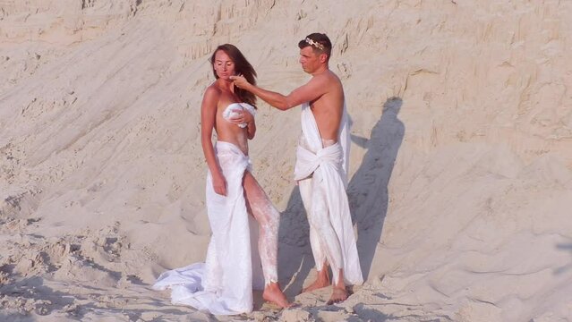 The male tyrant dominates the female. Open air performance by actors. They turn into marble statues.