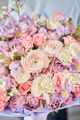 Obraz na płótnie Canvas Beautiful bouquet of flowers in woman hand. Floral shop concept . Beautiful fresh cut bouquet. Flowers delivery