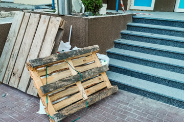 deteriorating exterior concrete staircase with rust stains and cracks, requiring specialized high-strength rust-inhibiting cement resurfacing to restore its appearance and function.