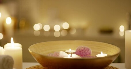 Relax, luxury and candles at a massage spa for wellness, peace and meditation. Zen, holistic and a flame from a candle on a table for calm, physical therapy and a spiritual retreat at a salon