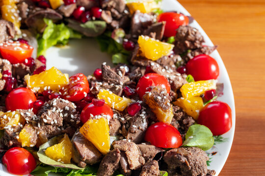 Warm salad with chicken liver, close up phoro