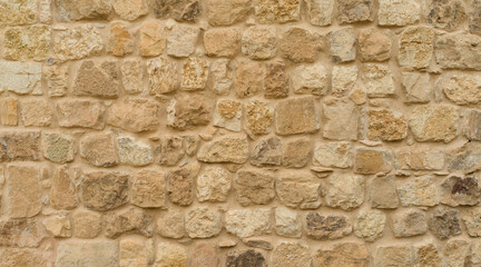 Stone wall background, limestone wall texture