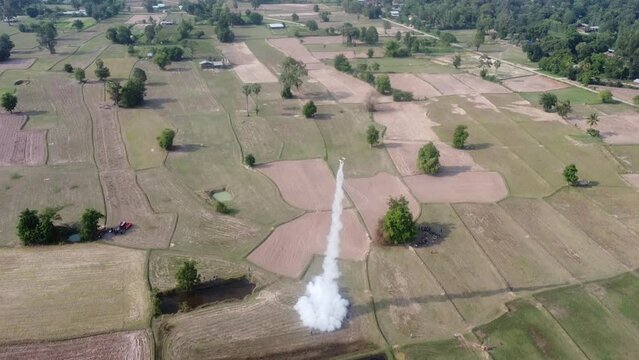 photo from drone. Sisaket, THAILAND - May 2022 : Bun Bang Fai Festival. Thai tradition of firing rockets rain,Rocket Festival show on May,2022 in SISAKET, Thailand.