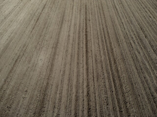 Aerial view of a plowed and cultivated field for background
