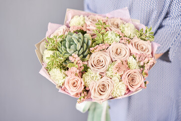 Beautiful bouquet of mixed flowers in woman hand. Floral shop concept . Beautiful fresh cut...