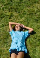 Girl lying on the grass.