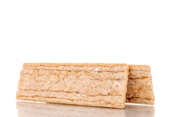 Two rye crispbreads, macro, isolated on white background.