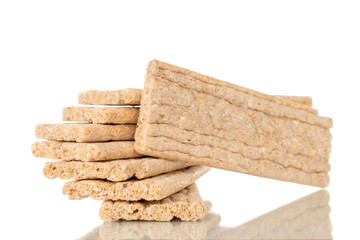 Several rye crispbreads, macro, isolated on white background.