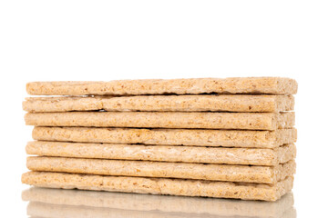 Several rye crispbreads, macro, isolated on white background.