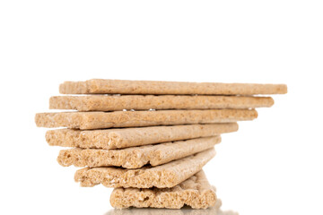 Several rye crispbreads, macro, isolated on white background.