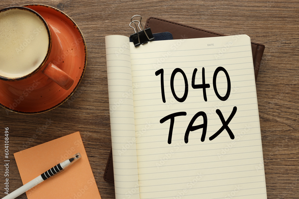 Poster 1040 tax open notepad with clip. text on the page