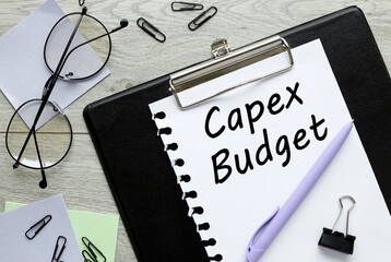 Capex budget clip folder, text on page. Business and budgeting concept