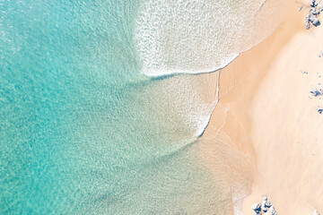 View of a surfer in a blue ocean