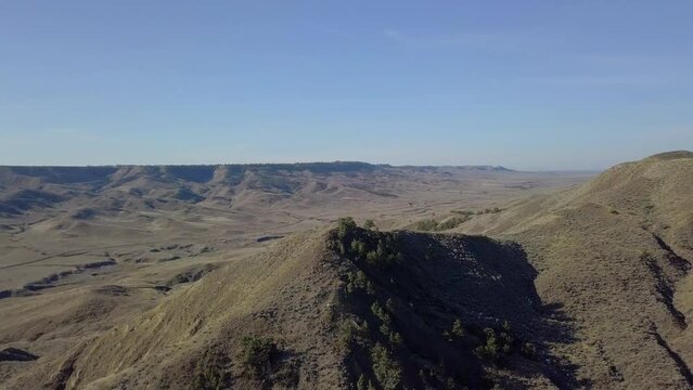 Drone flying over prairie peak and hill side in Montana