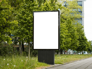 Outdoor advertisement template with a blank screen. Empty billboard panel next to a sidewalk. Urban area with commercial ads in the public space. 
