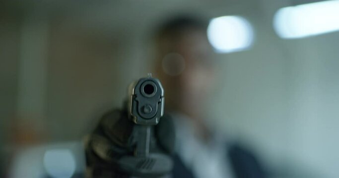 Gun violence, criminal and hand of a black man in a parking lot for crime, robbery and threat. African person or gangster aiming at target with weapon, firearm or pistol as warning, attack or danger