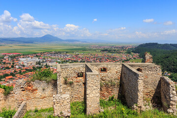 Fototapeta na wymiar View of the city of Rasnov from the territory of the medieval fortress Rasnov Citadel in the mountains of Transylvania. Romania