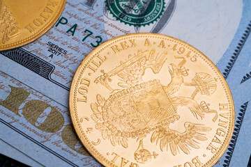 Austrian four ducats on US dollars. Investments in investment coins. The concept of buying gold. investment in gold.