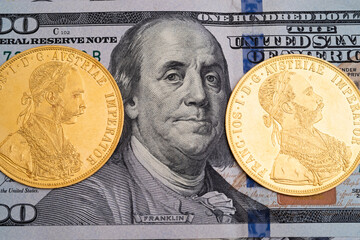 Austrian four ducats on US dollars. Investments in investment coins. The concept of buying gold....