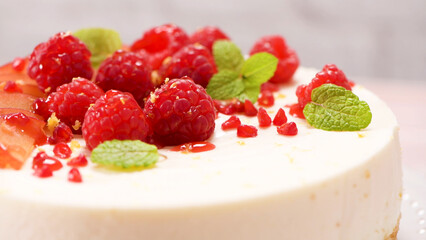 Cheesecake with fresh raspberries and plums