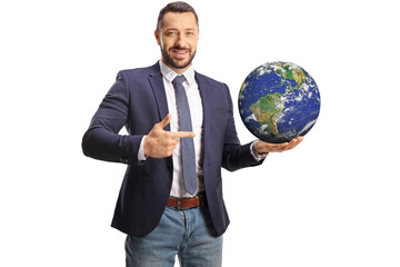 Young man holding the planet earth on his hand and pointing