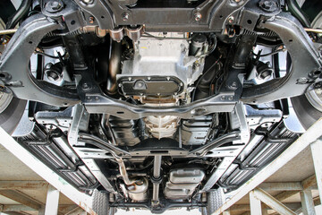 Bottom view of chassis, suspension, fuel tank of pickup car. - obrazy, fototapety, plakaty