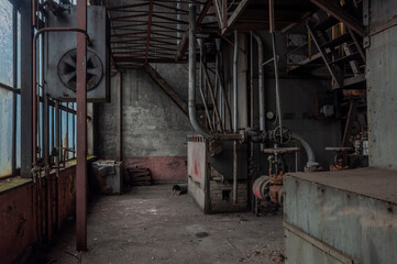 Fototapeta na wymiar Exploring the Enigmatic Beauty of an Abandoned, Historic Boiler Room: Unveiling the Secrets of a Forgotten Architectural Gem