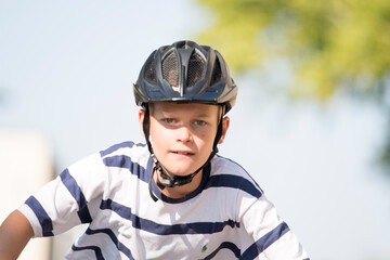 portrait of a man wearing helmet and driving bicycle very fast
