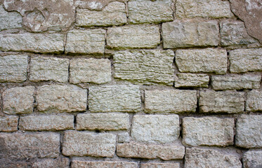 Antique wall made of blocks, bricks with mold. Ancient architecture. Antique wall.