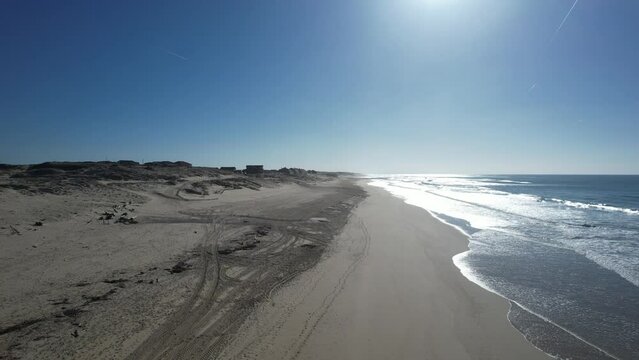 taking off from the beach revealing landscape in the form of postcard