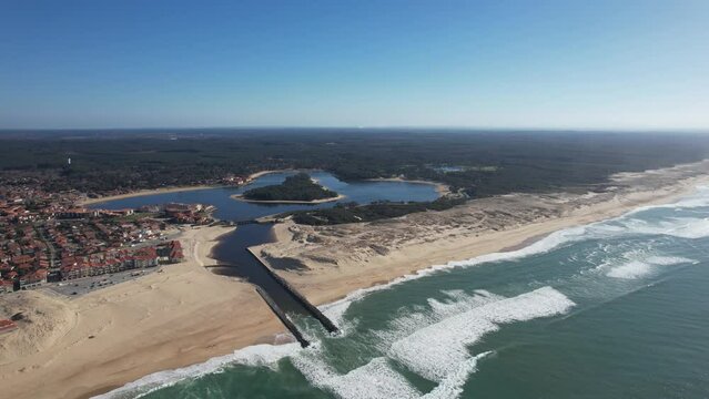 View taken from the air, in an arc towards the left of the marine lake of Vieux Boucau and its mouth, between the beach of the estacade, and Soustons's beach, in France
