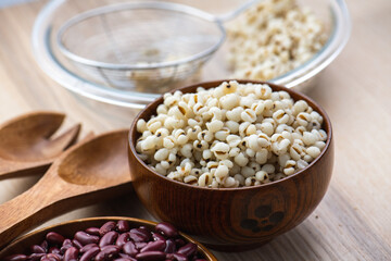 Hot Boiled Job’s Tears millet seed from boiler. White boiled Job’s Tears is highly nutritious cereal healthy fresh organic in salad dish.