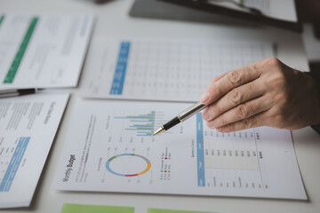 Executives and managers are meeting in a conference room, on the table there are some documents about the company's finances, managers are discussing financial information with the management.