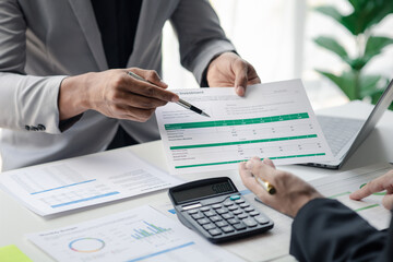 Executives and managers are meeting in a conference room, on the table there are some documents about the company's finances, managers are discussing financial information with the management.