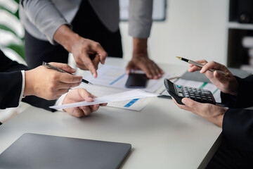 Meeting room atmosphere, business people meeting together on finance topics, they are working together to plan and solve corporate finance issues. Concept of business administration and finance.