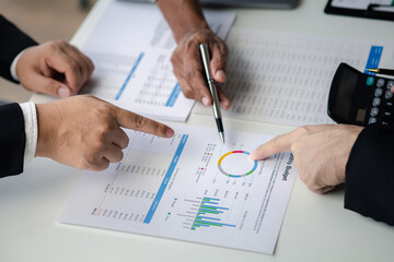 Meeting room atmosphere, business people meeting together on finance topics, they are working together to plan and solve corporate finance issues. Concept of business administration and finance.