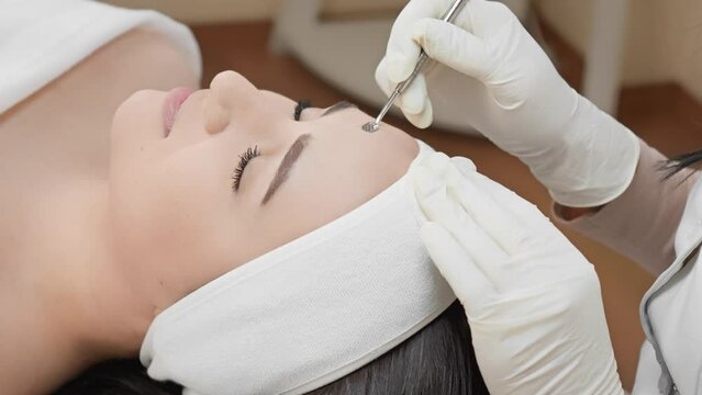 Professional deep facial cleansing as clinically proven method that gives women cleanliness, health and beauty skin after visiting beauty salon. Close-up girl emotionally peaceful and relaxing