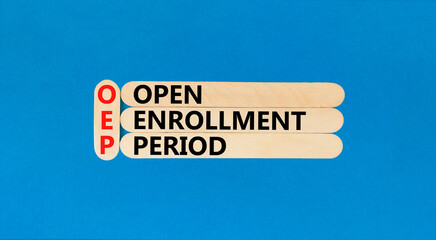 OEP symbol. Concept words OEP Open enrollment period on beautiful wooden sticks. Beautiful blue table blue background. Medical and OEP Open enrollment period concept. Copy space.