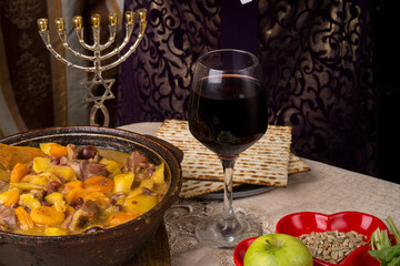 A woman at the table set for the Passover Seder.