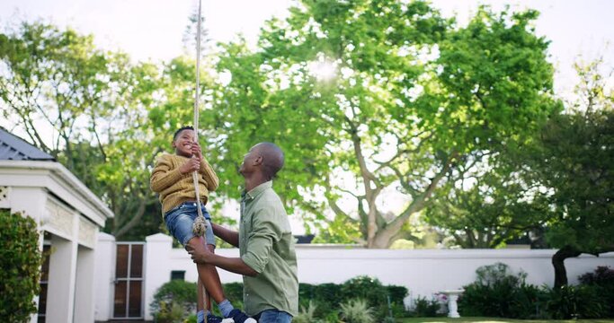 Family, black father and son with a swing, backyard and happiness with bonding, loving and relax. Parent, happy male child and boy with dad, kid and joyful in the garden, playing and summer holiday